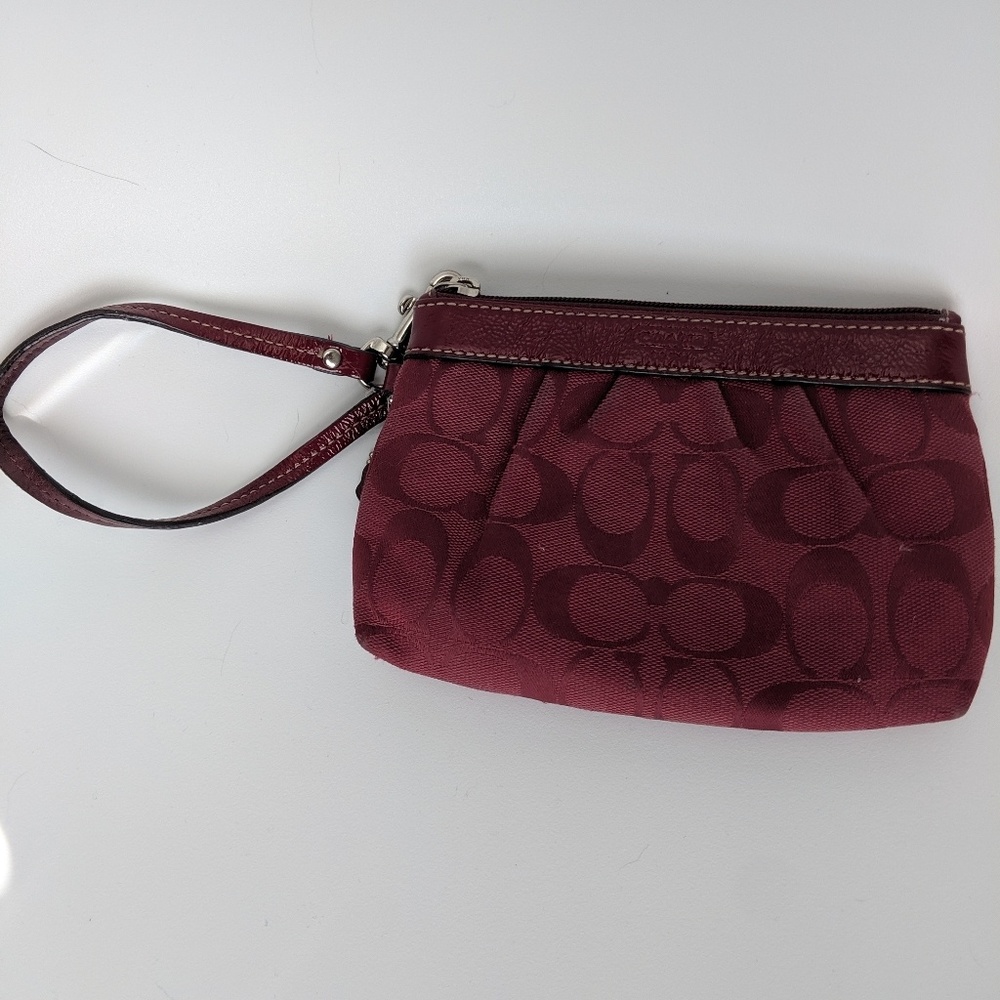 Dark red Coach wristlet